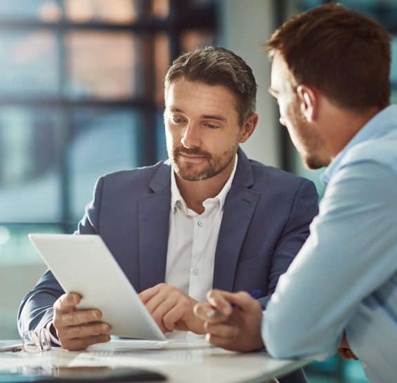 Business men speaking in a meeting